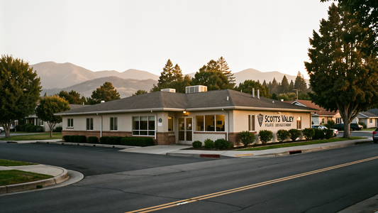 Scotts Valley Police Department building at golden hour in a small California coastal town with trees and mountains in the background